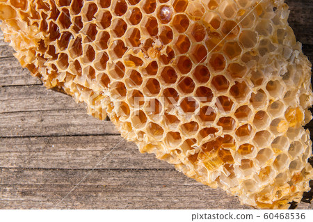 Section of wax honeycomb from beehive on the Section of wax honeycomb from beehive on the 60468536