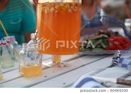 Barbecue or picnic outdoors on a hot summer day Barbecue or picnic outdoors on a hot summer day 60469200