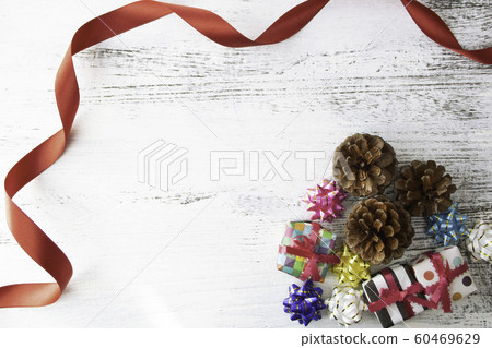 Christmas background: origami gifts and pine cones Christmas background: origami gifts and pine cones 60469629
