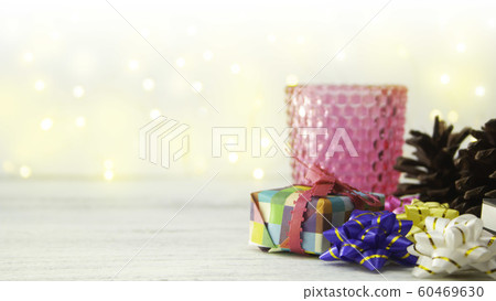 Christmas background: origami gifts and pine cones Christmas background: origami gifts and pine cones 60469630