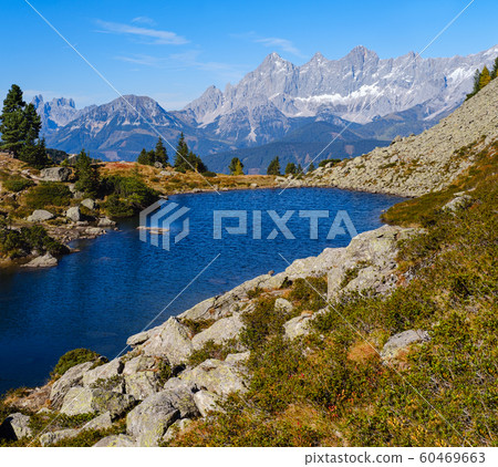 Calm autumn Alps mountain lake with clear Calm autumn Alps mountain lake with clear 60469663