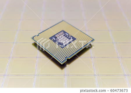 Photo of a Computer Chip CPU put on silicon wafer Photo of a Computer Chip CPU put on silicon wafer 60473673