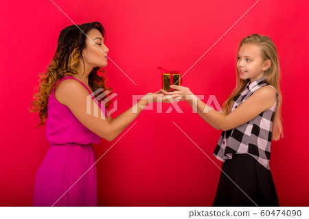 Cheerful mom and her cute daughter girl holding Cheerful mom and her cute daughter girl holding 60474090