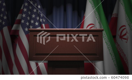 Many flags of Iran and the USA behind speaker tribune, 3D rendering 60474098