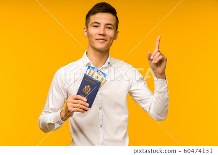 A handsome asian man in a white shirt rejoices in A handsome asian man in a white shirt rejoices in 60474131