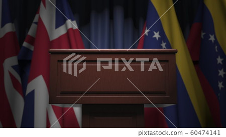 Many flags of Venezuela and the United Kingdom behind speaker tribune, 3D rendering Many flags of Venezuela and the United Kingdom behind speaker tribune, 3D rendering 60474141