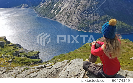 Contemplation of a beautiful fjord in Norway Contemplation of a beautiful fjord in Norway 60474349