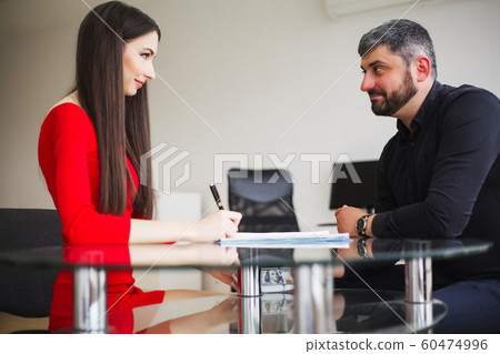 Business Woman Gives Money to Men. Woman Dressed in Red Dress Gives Bribe. Business Man In Gray Jacket Gets Bribe. High Resolution 60474996