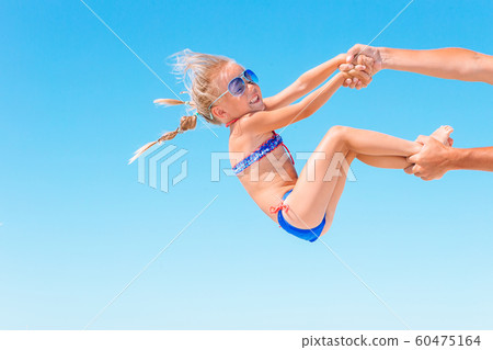 Portrait of a kid upside down on a sky background Portrait of a kid upside down on a sky background 60475164