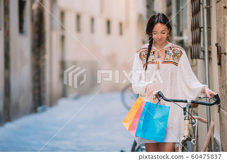 Young woman walking along the deserted streets of Europe. Young woman walking along the deserted streets of Europe. 60475837