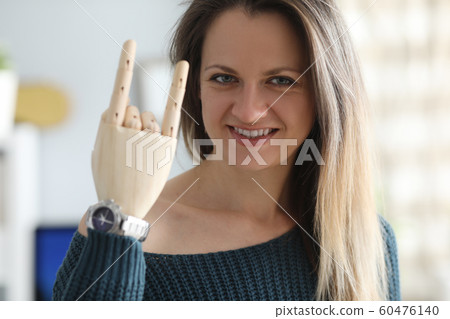 Smiling woman with prosthetic arm Smiling woman with prosthetic arm 60476140