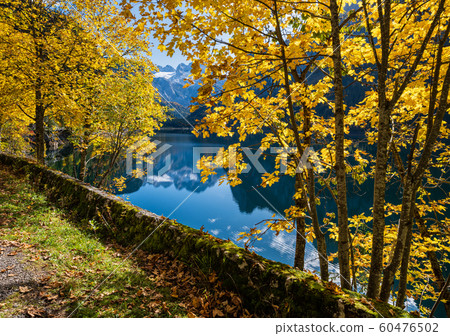Peaceful autumn Alps mountain lake with Peaceful autumn Alps mountain lake with 60476502