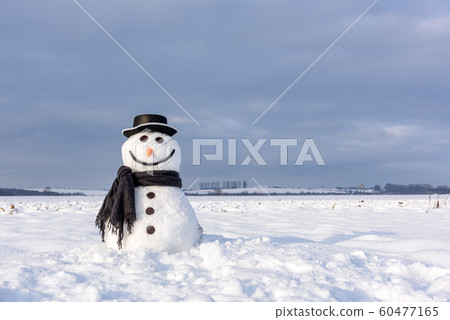 Funny snowman in black hat Funny snowman in black hat 60477165