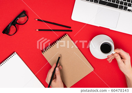 School and office supplies lie neatly on a red background 60478143