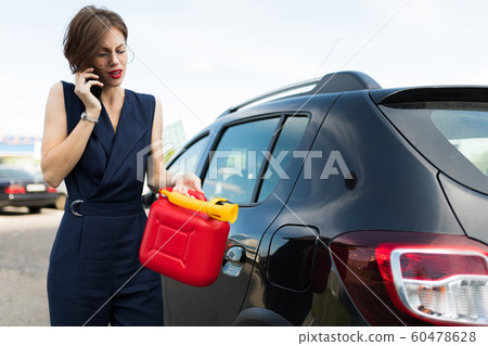 Beutiful woman in strict style of clothing gets out of the car for an important meeting in the Beutiful woman in strict style of clothing gets out of the car for an important meeting in the 60478628