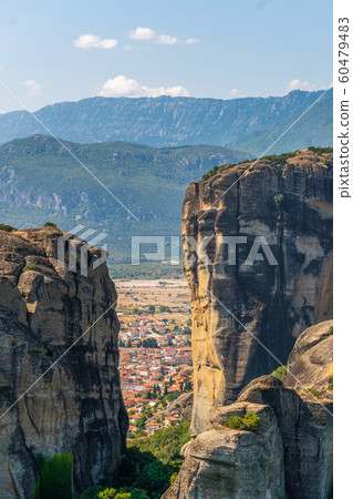 Rocks and houses with red roofs in Greece Rocks and houses with red roofs in Greece 60479483