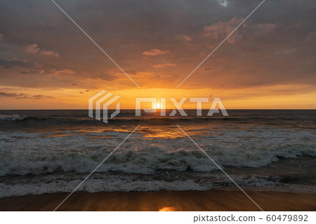 Beautiful sunset on the shore of the Indian Ocean Beautiful sunset on the shore of the Indian Ocean 60479892