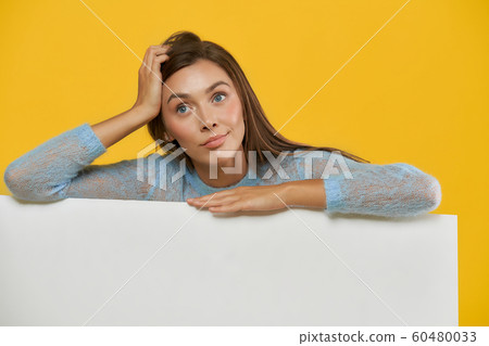 Close up of smiling girl leaning on banner. 60480033