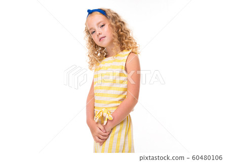 blond girl in a light dress on a white background 60480106