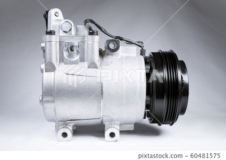Close-up New car air conditioning compressor on grey background 60481575