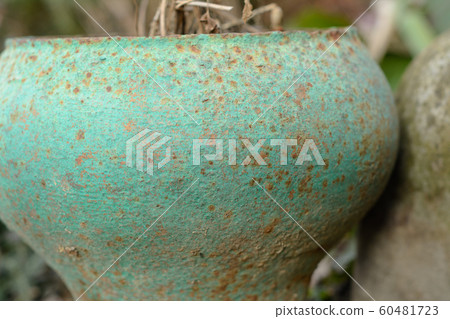 Old cast iron jug, standing in the yard for 60481723