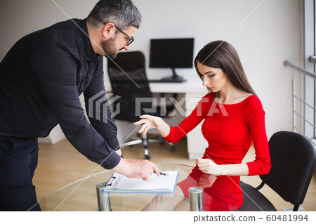 Business. Business Woman Gives Money to Men. Woman Dressed in Red Dress Gives Bribe. Business Man In Gray Jacket Gets Bribe. High Resolution 60481994