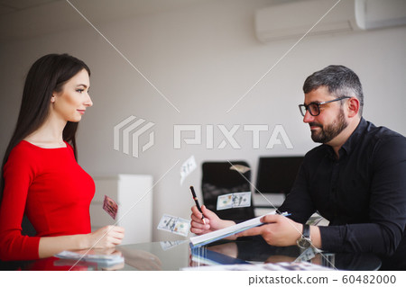 Business. Business Woman Gives Money to Men. Woman Dressed in Red Dress Gives Bribe. Business Man In Gray Jacket Gets Bribe. High Resolution Business. Business Woman Gives Money to Men. Woman Dressed in Red Dress Gives Bribe. Business Man In Gray Jacket Gets Bribe. High Resolution 60482000