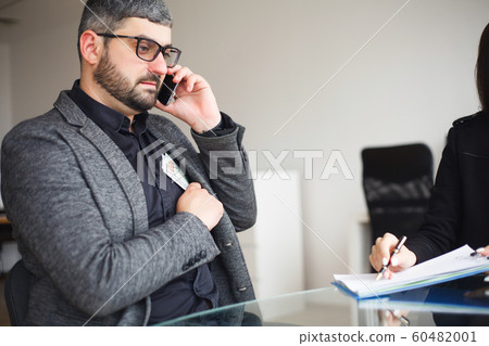 Business. Business Man Sitting at the Desk and Signing Contract. Man takes Bribe for Signing the Contract. High Resolution Business. Business Man Sitting at the Desk and Signing Contract. Man takes Bribe for Signing the Contract. High Resolution 60482001