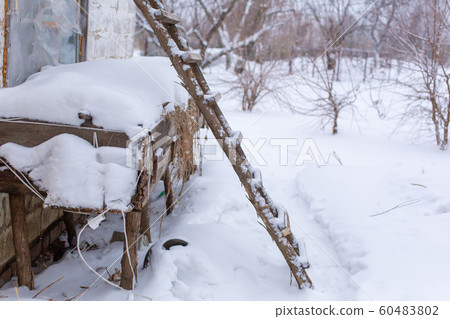 Winter, wooden stairs on the street, covered with 60483802