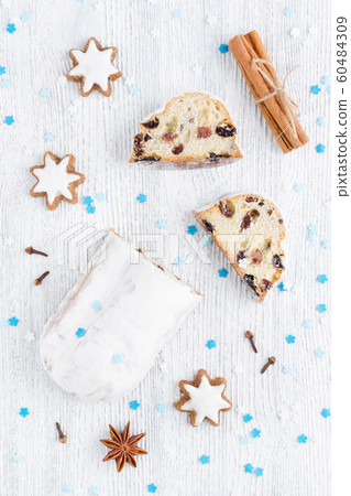 traditional german christmas cake stollen with cookies and decoration traditional german christmas cake stollen with cookies and decoration 60484309