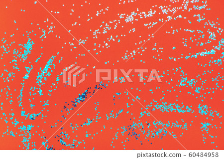 Blue shiny sequins on orange background. Blue shiny sequins on orange background. 60484958