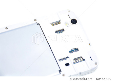 A cell phone with an open cover lies face down on A cell phone with an open cover lies face down on 60485829