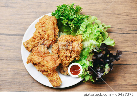 Fried chicken crispy on white plate with ketchup 60487375