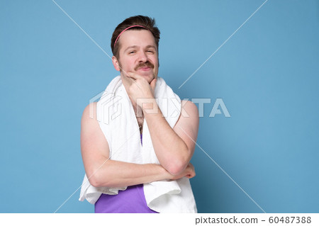 Young caucasian sport man with mustache and whit towel relaxed thinking 60487388
