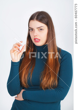 Woman with broken cigarette - stop smoking concept 60487773