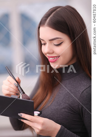 Beauty Girl with Makeup Brush. Natural Make-up for Brunette 60487810