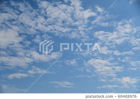Soft blue sky background with white fluffy cloudscape nature background Soft blue sky background with white fluffy cloudscape nature background 60488976