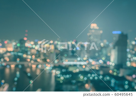 Blur city background rooftop view of cityscape business building landscape night lights bokeh Blur city background rooftop view of cityscape business building landscape night lights bokeh 60495645