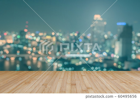 Wood floor terrace or wooden table with blur background rooftop perspective view city night light bokeh Wood floor terrace or wooden table with blur background rooftop perspective view city night light bokeh 60495656