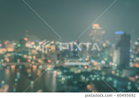 Blur city background rooftop view of cityscape business building landscape night lights bokeh Blur city background rooftop view of cityscape business building landscape night lights bokeh 60495692