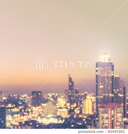 Blur city background rooftop view of cityscape business building landscape night lights bokeh in vintage tone Blur city background rooftop view of cityscape business building landscape night lights bokeh in vintage tone 60495981