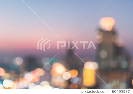 Blur city background rooftop view of cityscape business building landscape night lights bokeh Blur city background rooftop view of cityscape business building landscape night lights bokeh 60495987