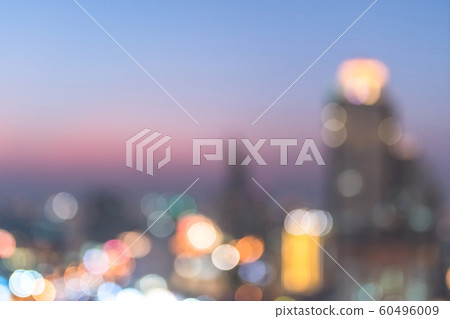 Blur city background rooftop view of cityscape business building landscape night lights bokeh 60496009