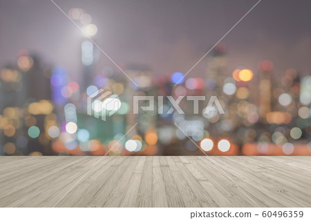Wood floor terrace or wooden table with blur background rooftop perspective view city night light bokeh background of cityscape 60496359