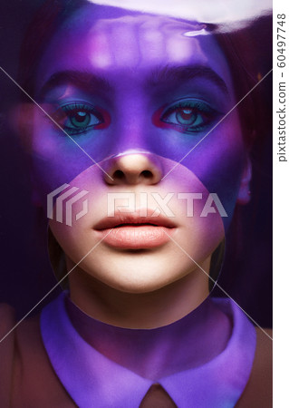 beautiful girl with color make-up behind of beautiful girl with color make-up behind of 60497748