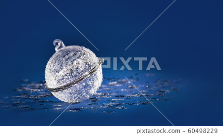 Christmas white crystal bauble on blue glitter banner 60498229