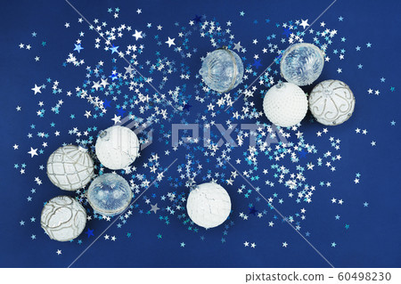 Christmas white baubles collection on blue glitter Christmas white baubles collection on blue glitter 60498230