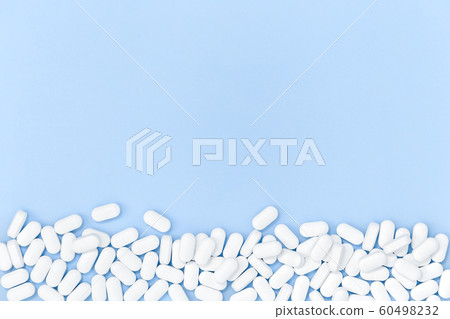 Background of white monochrome tablets on blue 60498232