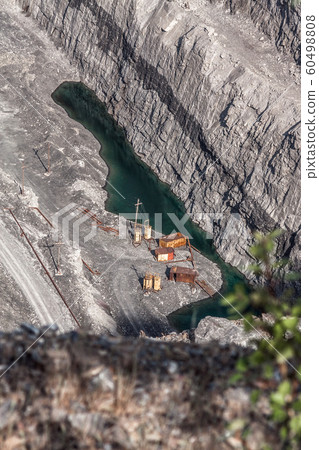 Abandoned industry structures and small pond at the bottom of st 60498808