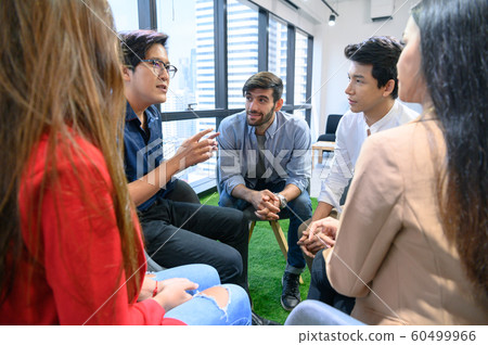 Psychotherapist inquiring about symptoms occurring 60499966